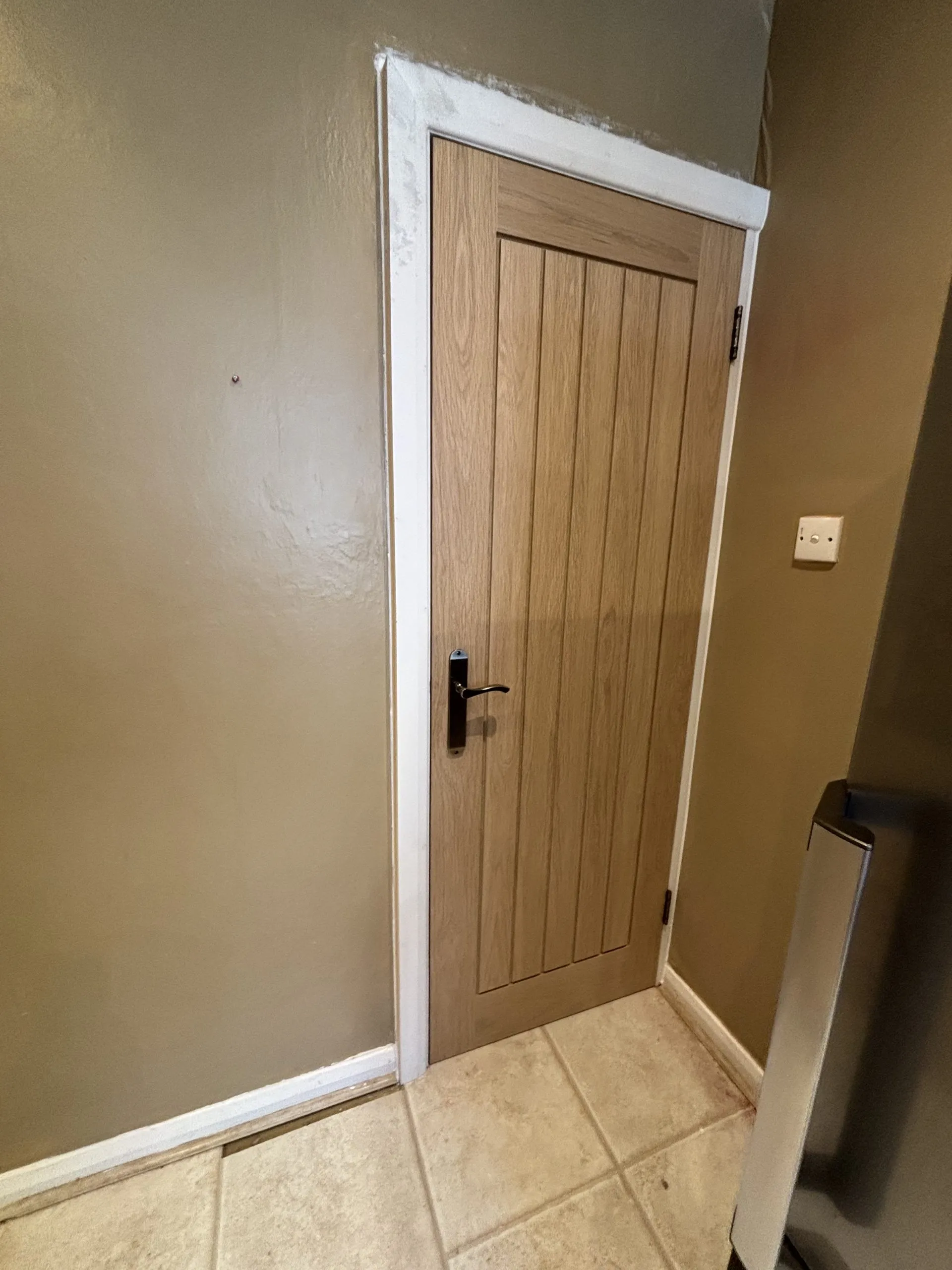 Finished internal glazed door installation