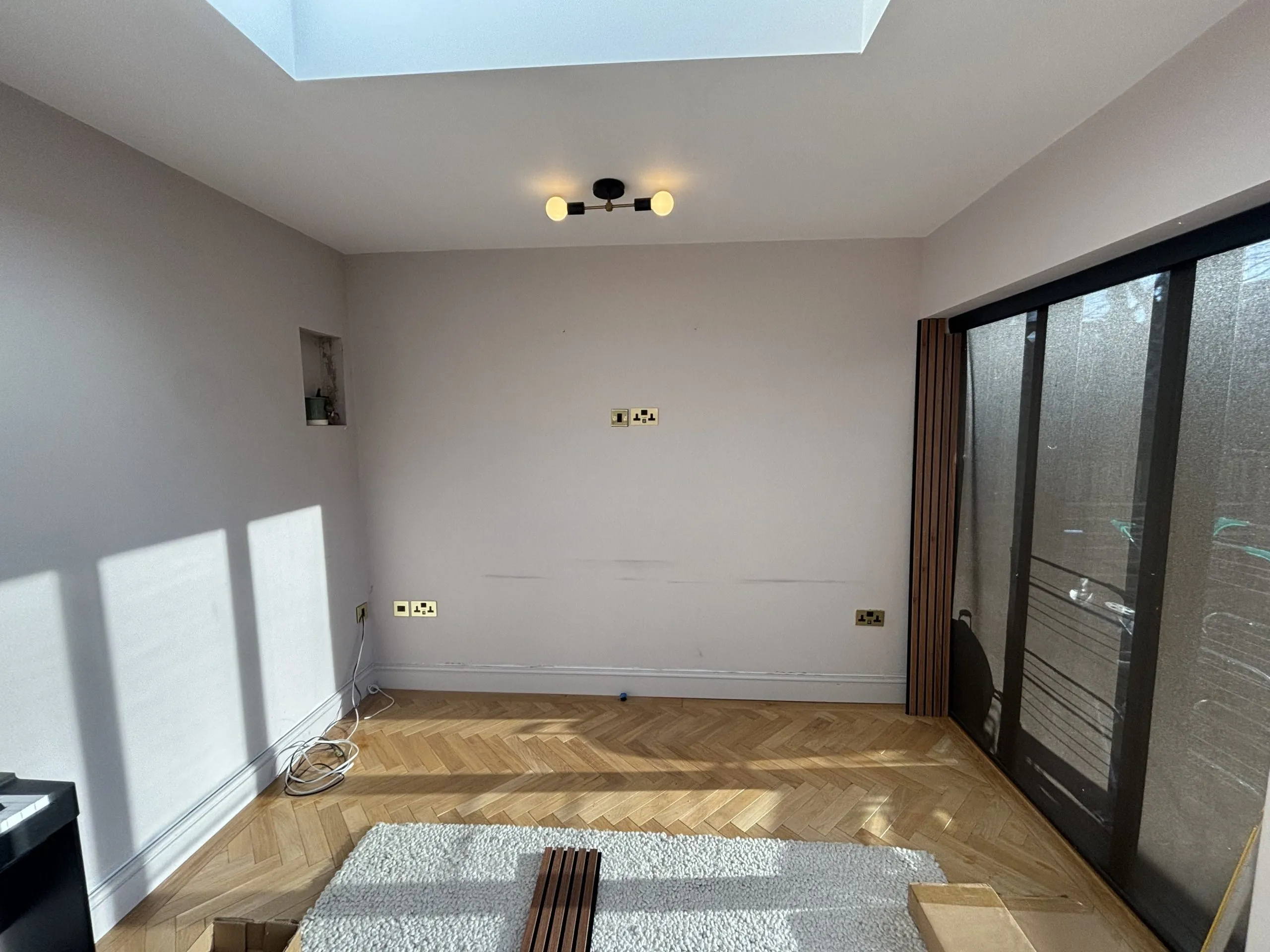 Plain wall before slat wall installation